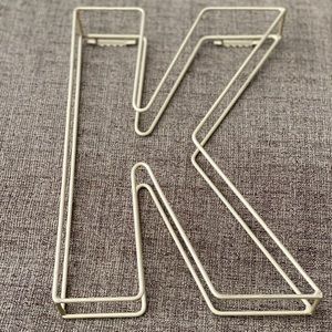 Matte gold metal “K”